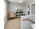Upstairs hallway features wood floors, natural light, and furniture decor at 4541 Moray Dr, Mableton, GA 30126