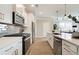 Modern kitchen features stainless steel appliances, stone backsplash, and sleek countertops at 4541 Moray Dr, Mableton, GA 30126