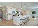 Bright kitchen features white cabinets, a large island, and modern appliances at 4541 Moray Dr, Mableton, GA 30126