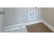 Neutral laundry room with new washer hook ups and vinyl flooring at 4541 Moray Dr, Mableton, GA 30126