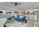 Open-concept living space featuring a modern kitchen, living room, and stylish decor at 4541 Moray Dr, Mableton, GA 30126