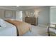 Bedroom featuring neutral décor, a decorative dresser, and a king size upholstered bed at 4541 Moray Dr, Mableton, GA 30126