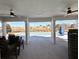 Covered patio area with ceiling fans overlooking a sparkling blue pool at 4541 Moray Dr, Mableton, GA 30126