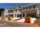 Row of new townhomes showcasing garages and varied facade designs at 4541 Moray Dr, Mableton, GA 30126