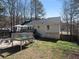 Large backyard area with a patio, deck, and outdoor seating, perfect for enjoying the outdoors and entertaining at 70 Nw Willow Bend Dr, Cartersville, GA 30121