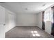 Unfinished basement with carpet, a window, and a drop ceiling, ready to be transformed into your desired space at 70 Nw Willow Bend Dr, Cartersville, GA 30121