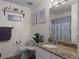 Well-lit bathroom with granite countertops and decorative accents at 70 Nw Willow Bend Dr, Cartersville, GA 30121