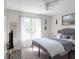 Comfortable bedroom with natural light, a ceiling fan, and decor at 70 Nw Willow Bend Dr, Cartersville, GA 30121
