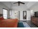 Comfortable bedroom featuring a ceiling fan and modern decor at 70 Nw Willow Bend Dr, Cartersville, GA 30121