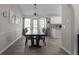 Elegant dining room with wood floors, large windows, and stylish decor at 70 Nw Willow Bend Dr, Cartersville, GA 30121