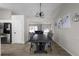 Bright dining area with a large table and chairs, open to the living room at 70 Nw Willow Bend Dr, Cartersville, GA 30121