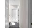Hallway with multiple white doors and dark wood floors at 70 Nw Willow Bend Dr, Cartersville, GA 30121