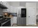 Well-lit kitchen featuring stainless steel appliances, white cabinetry, and granite countertops at 70 Nw Willow Bend Dr, Cartersville, GA 30121