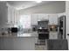 Modern kitchen with white cabinetry, stainless steel appliances, and granite countertops at 70 Nw Willow Bend Dr, Cartersville, GA 30121
