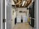 Functional laundry room with washer, dryer, storage shelves, and essential utilities for convenient laundry care at 70 Nw Willow Bend Dr, Cartersville, GA 30121