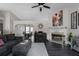 Open-concept living room with fireplace, high ceilings, and seamless flow to dining area at 70 Nw Willow Bend Dr, Cartersville, GA 30121