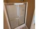 Walk-in shower with sliding glass doors and sleek hardware at 959 Gettysburg Way, Locust Grove, GA 30248