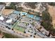 An aerial view shows neighborhood tennis courts, a clubhouse, playground, and extensive parking at 118 Fairway Overlook Dr, Acworth, GA 30101