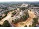 An aerial view shows neighborhood homes lining the golf course and pond at 118 Fairway Overlook Dr, Acworth, GA 30101