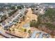 Aerial view of a residential neighborhood adjacent to a golf course with a pond and trees at 118 Fairway Overlook Dr, Acworth, GA 30101