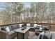 Inviting outdoor deck with comfortable wicker furniture and wooded backyard views at 118 Fairway Overlook Dr, Acworth, GA 30101