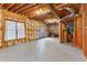 Spacious unfinished basement with concrete floors, and exposed beams and insulation at 118 Fairway Overlook Dr, Acworth, GA 30101