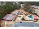 Aerial view of community amenities including a pool, playground, tennis courts, and basketball court at 118 Fairway Overlook Dr, Acworth, GA 30101