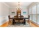 Traditional dining room featuring a chandelier, large windows, and elegant decor at 118 Fairway Overlook Dr, Acworth, GA 30101