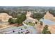 Aerial view of a golf course and residential area featuring a pond and lush greenery at 118 Fairway Overlook Dr, Acworth, GA 30101