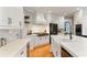 Spacious kitchen featuring a large island with a sink, white cabinetry, and hardwood floors at 118 Fairway Overlook Dr, Acworth, GA 30101