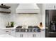 Close-up of a well-equipped kitchen with stainless steel appliances and a stylish tile backsplash at 118 Fairway Overlook Dr, Acworth, GA 30101