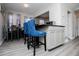 Eating area with a breakfast bar, white cabinets, and dining table at 185 Whetstone Way, Villa Rica, GA 30180