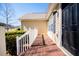 Charming wood porch with white railings, offers a warm welcome at 185 Whetstone Way, Villa Rica, GA 30180