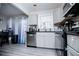 Kitchen area with stainless steel dishwasher and oven, and white cabinets at 185 Whetstone Way, Villa Rica, GA 30180