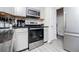 Modern kitchen with stainless steel oven, microwave, gray cabinets and ample countertop space at 185 Whetstone Way, Villa Rica, GA 30180