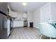 Bright kitchen featuring white cabinets, modern appliances, and wood-look flooring at 185 Whetstone Way, Villa Rica, GA 30180