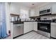 Well-equipped kitchen with stainless steel appliances, gray cabinets, and modern fixtures at 185 Whetstone Way, Villa Rica, GA 30180