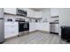 This modern kitchen features white cabinets, stainless steel appliances, and subway tile backsplash at 185 Whetstone Way, Villa Rica, GA 30180