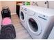 This spacious laundry room features side-by-side washer and dryer at 185 Whetstone Way, Villa Rica, GA 30180