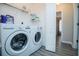 Practical laundry room with modern LG washer and dryer, and convenient shelving at 185 Whetstone Way, Villa Rica, GA 30180