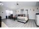 Spacious living room with vaulted ceiling, gray sofa, modern decor, and vinyl floors at 185 Whetstone Way, Villa Rica, GA 30180