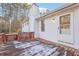 Charming back porch with a mix of worn wood and decorative lattice, inviting relaxation and outdoor enjoyment at 2248 Bethel Rd, Conyers, GA 30012