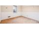 Empty bedroom with neutral walls, window, and worn carpet at 2248 Bethel Rd, Conyers, GA 30012