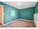 Bedroom with bright lighting and neutral-colored walls at 2248 Bethel Rd, Conyers, GA 30012