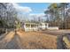 Spacious home exterior with fenced yard and tree line at 2248 Bethel Rd, Conyers, GA 30012