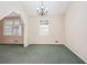 Bright living room featuring neutral walls and a decorative chandelier at 2248 Bethel Rd, Conyers, GA 30012