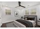 This cozy bedroom features recessed lights, a modern ceiling fan, and two windows for natural light at 2760 Swansea Ct, College Park, GA 30349