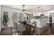 Dining area features a modern table, stylish chairs, pendant lighting, and sliding glass doors to the backyard at 2760 Swansea Ct, College Park, GA 30349