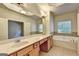 Bright bathroom showcasing dual sinks, garden tub, and natural light at 2790 Laurel Valley Trl, Buford, GA 30519