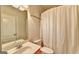 Bathroom featuring a standard toilet, sink, vanity mirror and shower with white curtain at 2790 Laurel Valley Trl, Buford, GA 30519